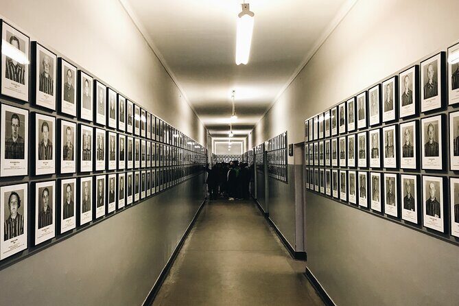 Auschwitz & Birkenau Guided Tour with Hotel Pickup from Krakow - Auschwitz I: entering through the gate, with headsets and a museum-licensed guide