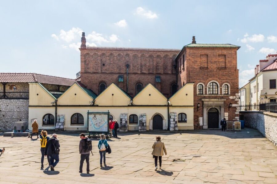Krakow: Kazimierz, Schindler's Factory & Ghetto with Guide - Former ghetto sights: wall, houses, Under the Eagle, and 68 chairs