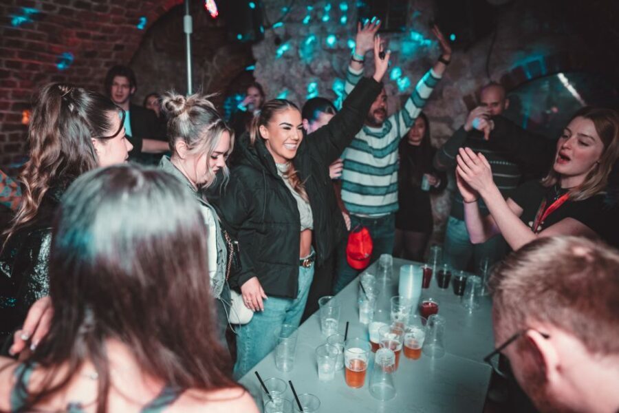 Krakow: Pub Crawl with 1 Hour of Unlimited Alcoholic Drinks - What to watch for: pace, club vibe, and group dynamics