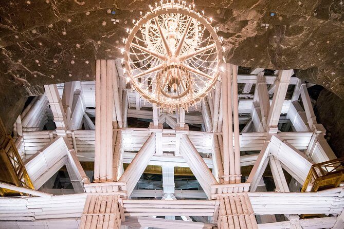 Krakow to Wieliczka: Salt Mine Guided Tour with Ticket & Transfer - Underground route highlights: 64 meters down, lakes and chapels, then 135 meters up