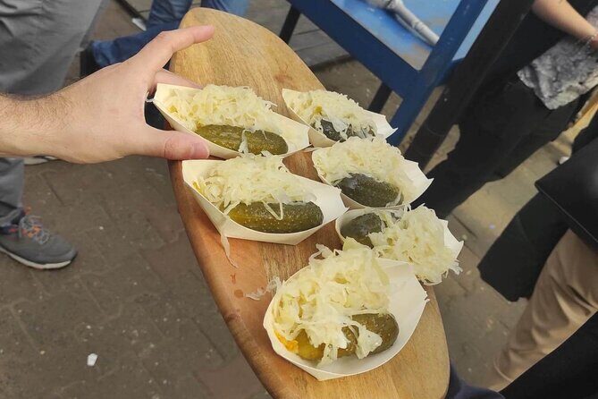 Walking Guided Tour with Street Food in Krakow - The first hour in Kraków Old Town: pierogi, obwarzanek, zapiekanka